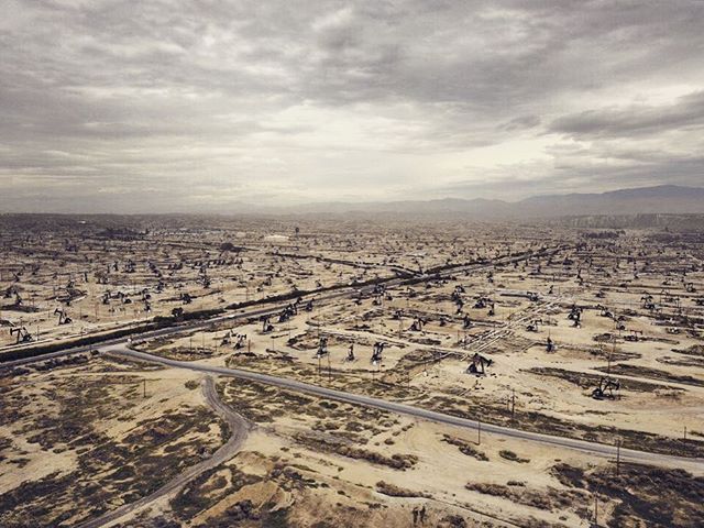 Bakersfield Oilfield. Miles and miles of oilpumps. Many of them very old and leaking, contributing to the worst air quality in the US. #airquality #drone #photojournalism